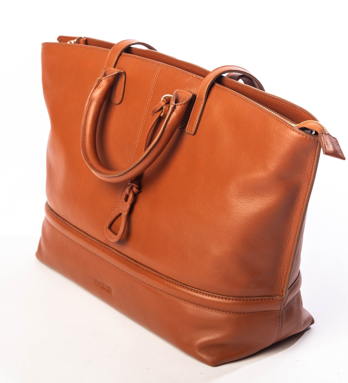 Brown leather tote bag. Large size. Handles, straps and charm can be seen.