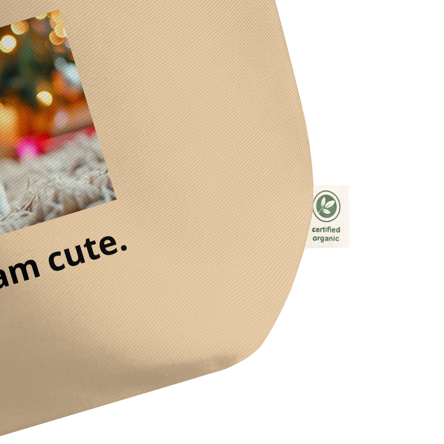 Beige cotton tote bag with cute dog print and text 'I am cute.' Certified organic cotton logo on a label.