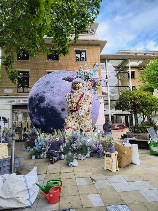 Large floral creations of the moon and an astronaut. On display at the annual Chelsea In Bloom event in London.