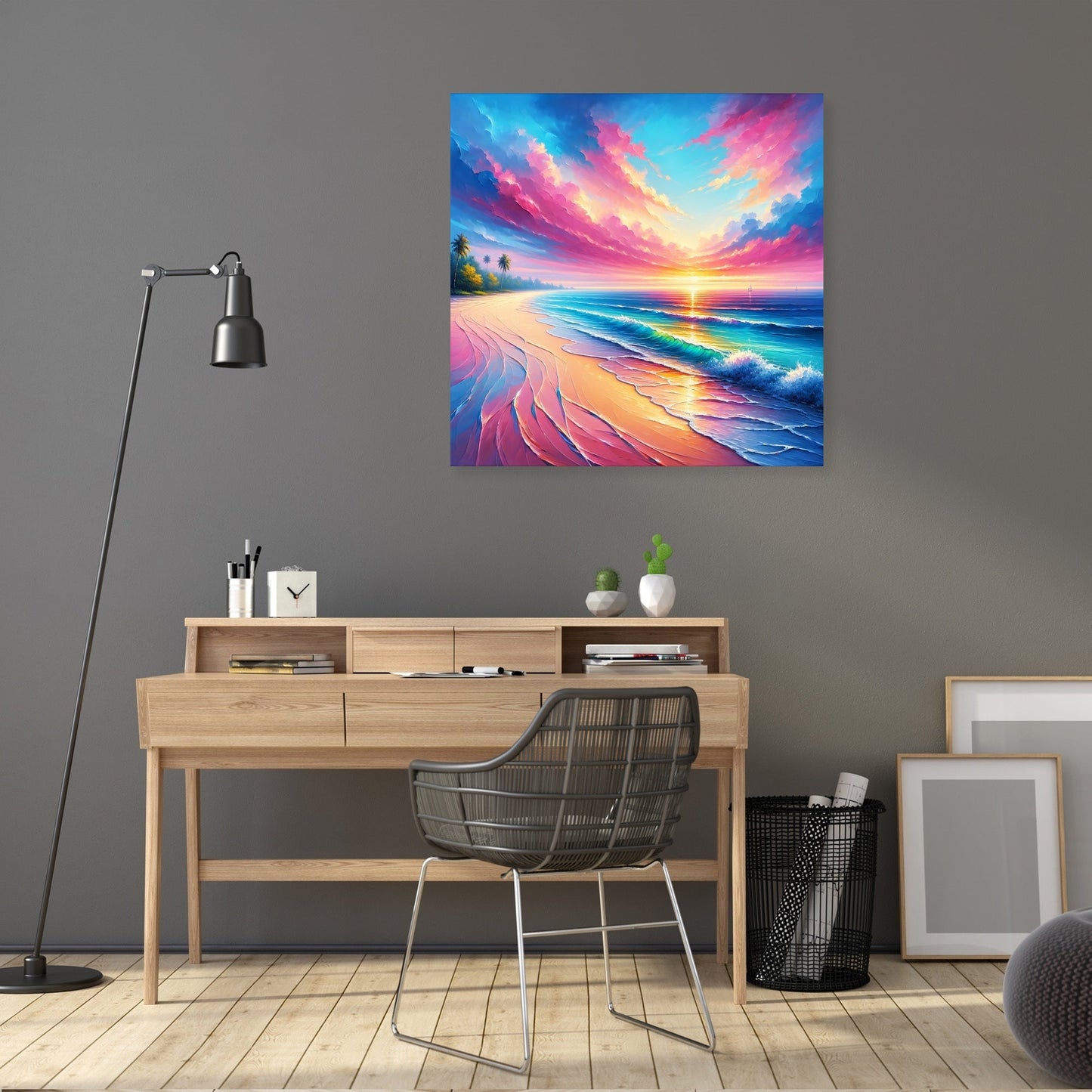 Tropical beach, palm trees, small waves, bright sun and large pink clouds in early morning scene. Printed on canvas with wood frame. Hanging on wall above a wooden desk. Plus tall lamp and mesh office chair.