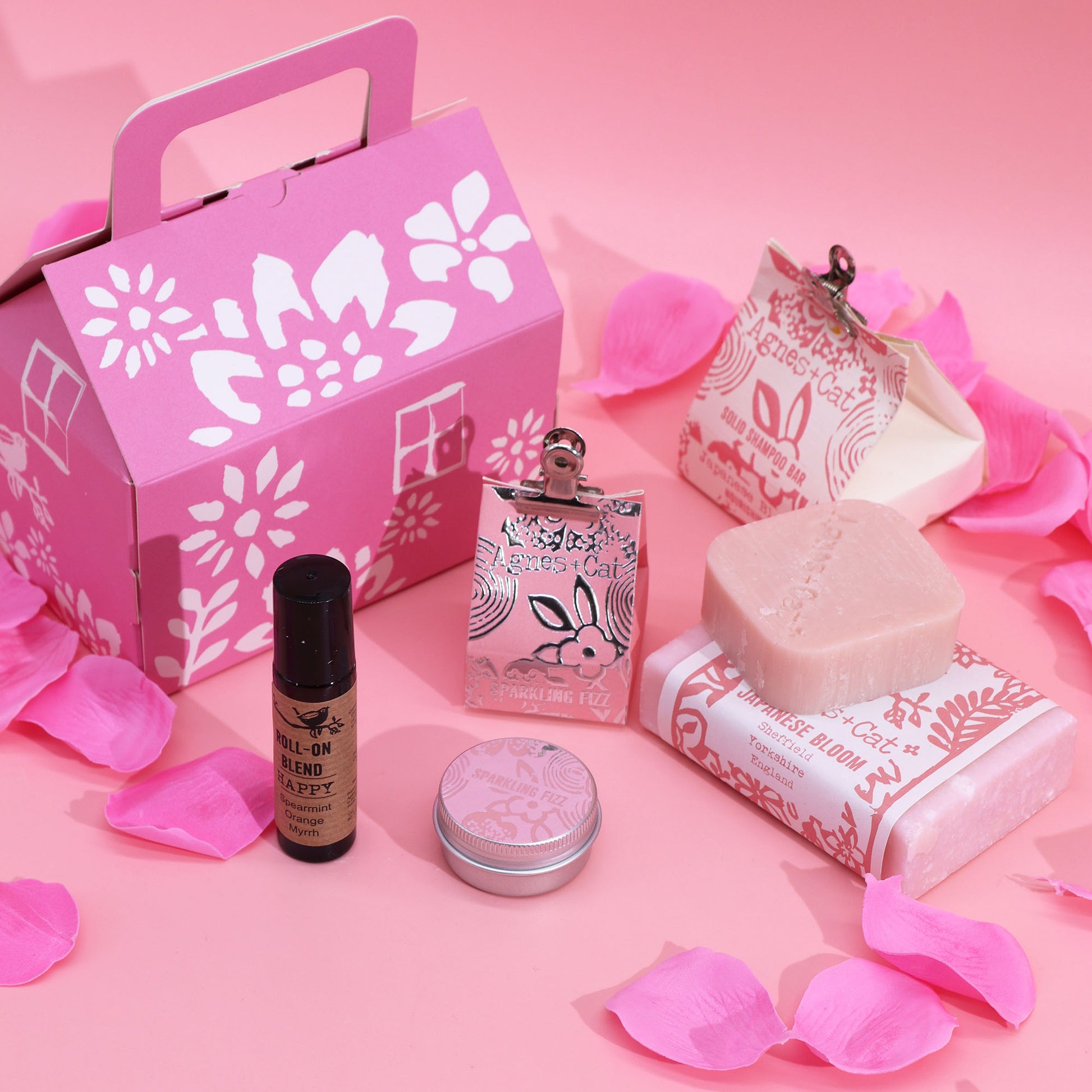 A bar of soap, bar of shampoo, lip balm and roll on deodorant. Natural ingredients. With a gift box.