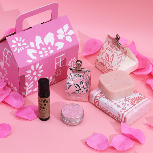 A bar of soap, bar of shampoo, lip balm and roll on deodorant. Natural ingredients. With a gift box.