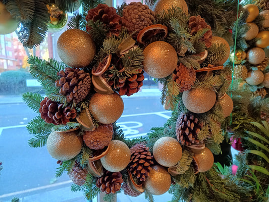 Exclusive, limited edition Christmas wreath with gold baubles, oranges and pine cones