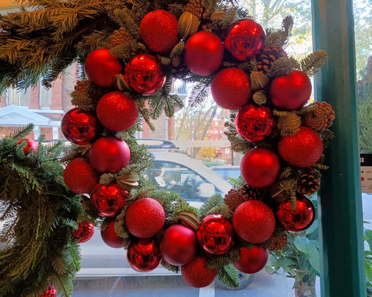 Exclusive, limited edition Christmas wreath with red baubles and pine cones