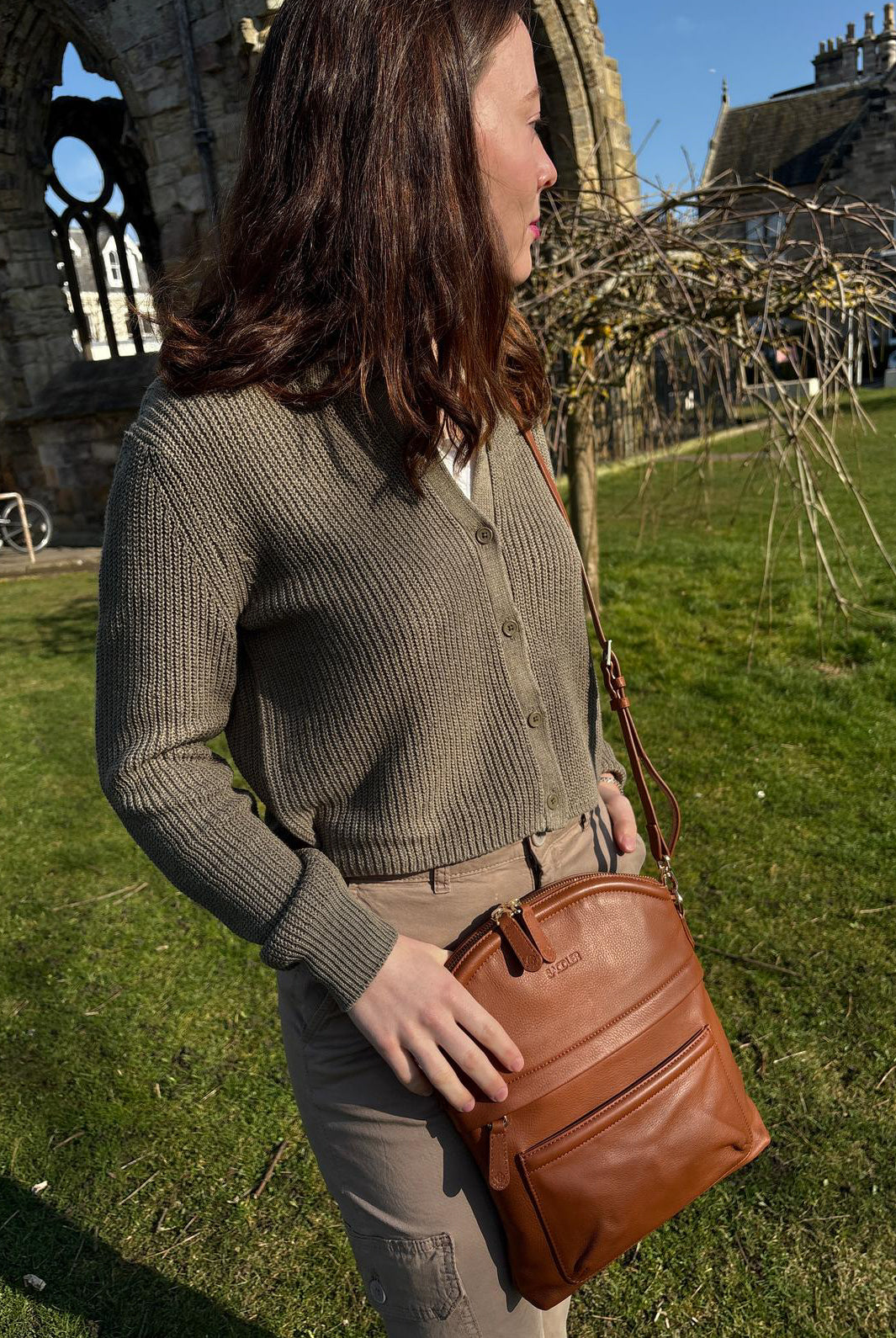 Kimberley handcrafted tan leather crossbody bag worn outdoors – heritage lifestyle shot
