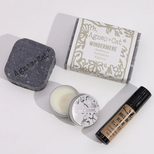 A bar of soap, shampoo, lip balm and roll on deodorant. Natural ingredients. Supplied in a gift box.