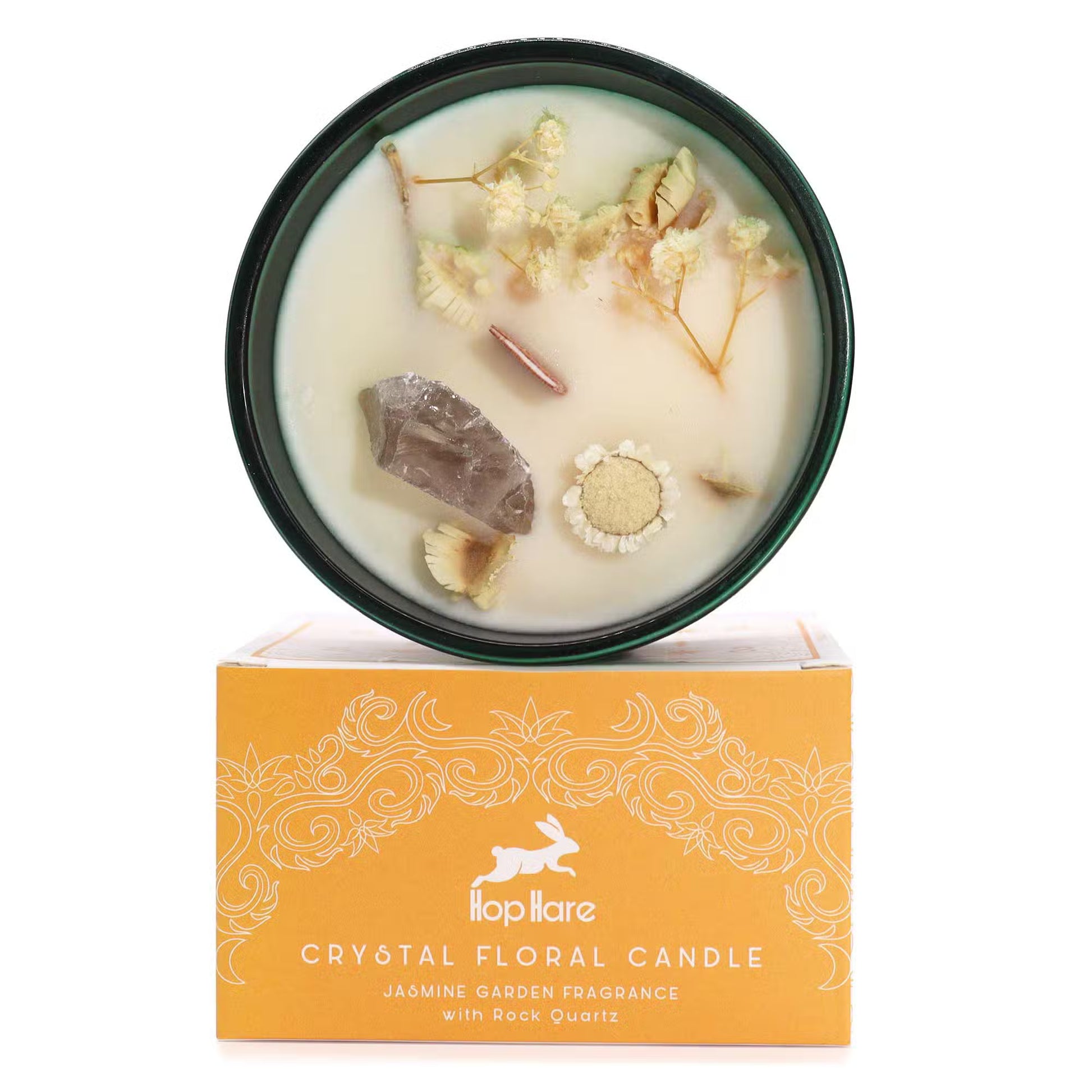 'The Lion.' Fragrance soy candle with Rock crystal and dried flowers. In a green glass jar. On top of gift box.