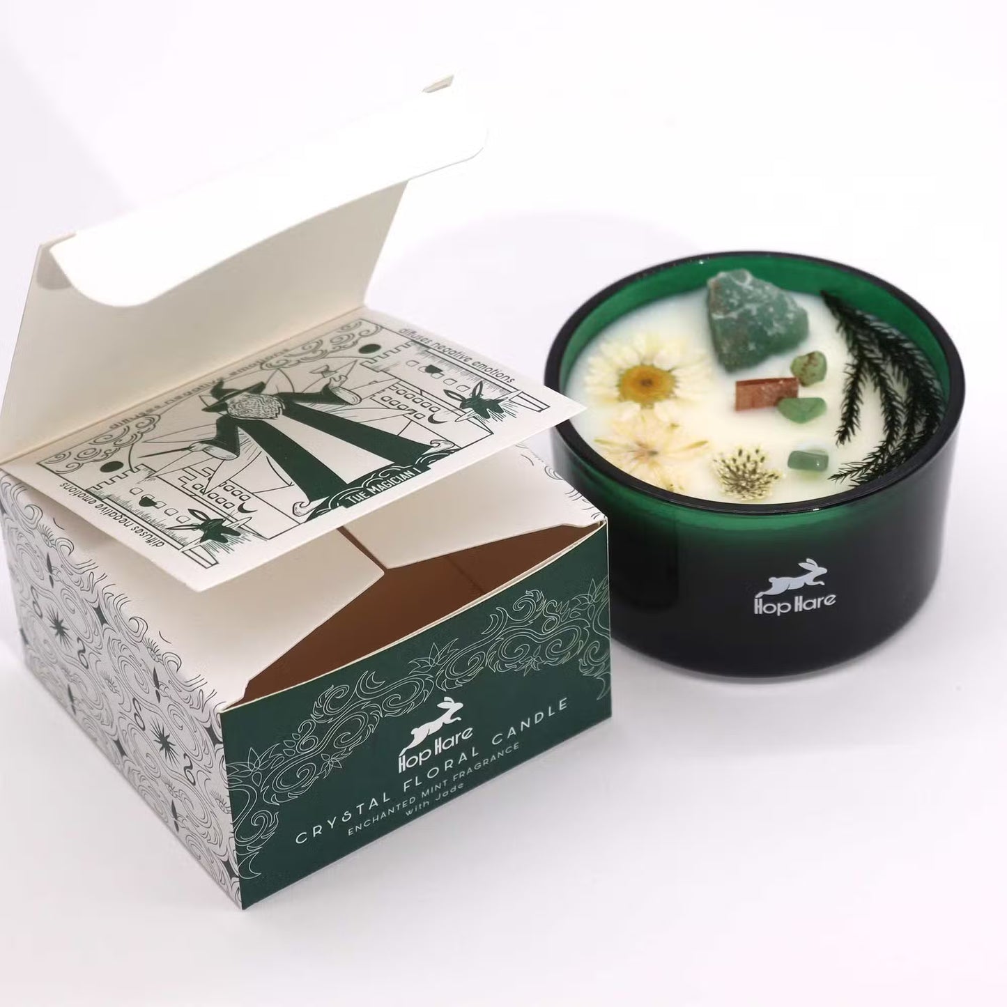 'The Magician'. Crystal floral candle in a green glass jar. Next to the descriptive gift box.