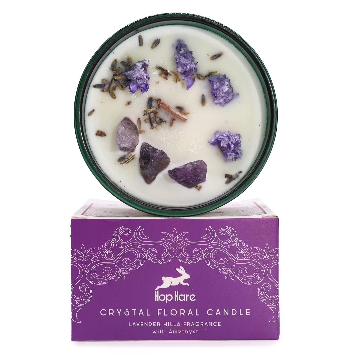 'The Moon.' Handcrafted floral candle with Amethyst crystals and dried lavender. On top of a gift box.