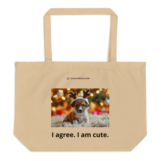 Large beige cotton tote bag. Printed with a dog wearing a hat with reindeer antlers and text 'I agree. I am cute.' on a blurred Christmas lights background.