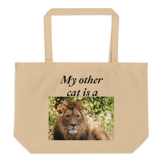 Large beige organic cotton tote bag. Custom printed. Big lion image below words: My other cat is a 