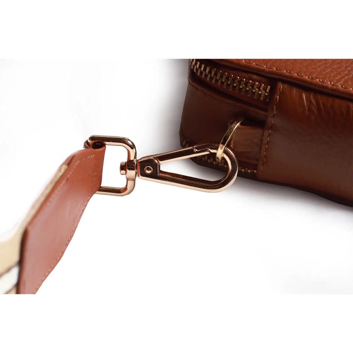 Side view of the Bayraw brown leather crossbody bag. Two zips, gold hardware and brown stripe strap.