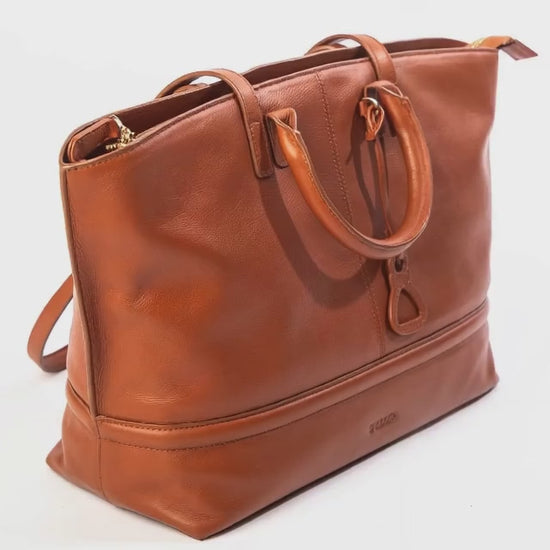 Close up view of the Saddler Victoria tan leather tote bag. Made by artisans.