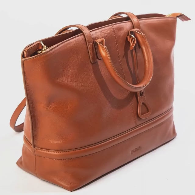 Close up view of the Saddler Victoria tan leather tote bag. Made by artisans.