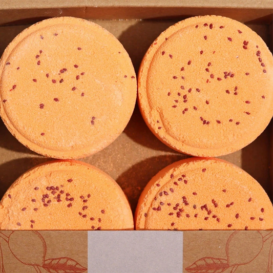 Four energising shower steamers with essential oils in a gift box. For aromatherapy and wellness.
